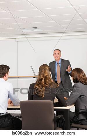 A lecturer teaching business students View Large Photo Image Picture - A lecturer teaching business students. Fotosearch