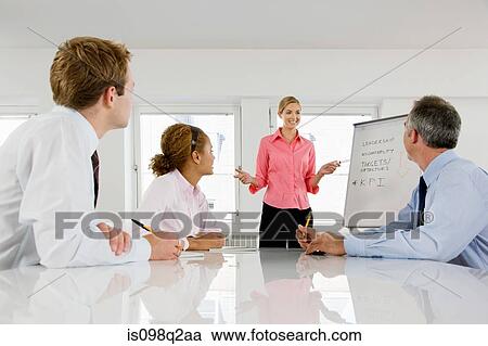A lecturer teaching business students View Large Photo Image Stock Image - A lecturer teaching business students. Fotosearch