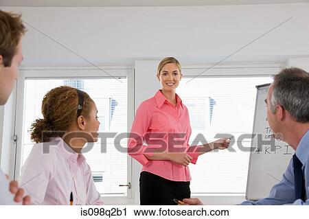 A lecturer teaching business students View Large Photo Image Stock Image - A lecturer teaching business students. Fotosearch