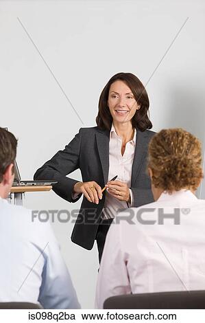A lecturer teaching business students View Large Photo Image Stock Image - A lecturer teaching business students. Fotosearch