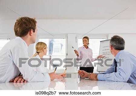 Stock Photo - A lecturer teaching business students. Fotosearch