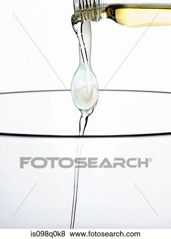 Pouring aromatherapy oil View Large Photo Image Stock Photo - Pouring aromatherapy oil. Fotosearch