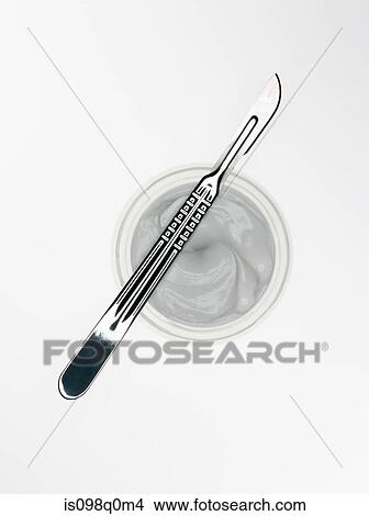 Scalpel and cosmetic cream View Large Photo Image Picture - Scalpel and cosmetic cream. Fotosearch