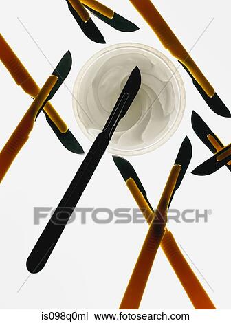 Scalpel and cosmetic cream View Large Photo Image Stock Image - Scalpel and cosmetic cream. Fotosearch