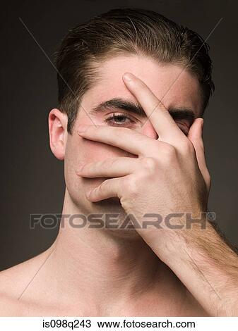 Man with hand over face View Large Photo Image Stock Image - Man with hand over face. Fotosearch