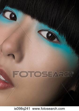 Woman wearing turquoise eyeshadow View Large Photo Image Stock Image - Woman wearing turquoise eyeshadow. Fotosearch