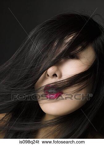Woman with hair over her face View Large Photo Image Stock Photograph - Woman with hair over her face. Fotosearch