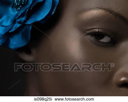 Young woman wearing flower View Large Photo Image Stock Image - Young woman wearing flower. Fotosearch