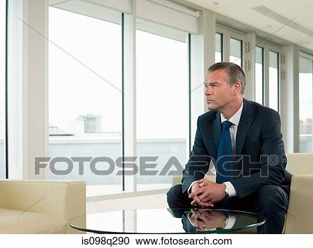 Stock Image - Businessman thinking. Fotosearch