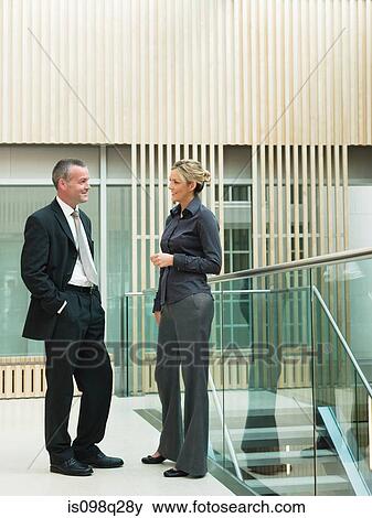 Colleagues talking View Large Photo Image Stock Photo - Colleagues talking. Fotosearch