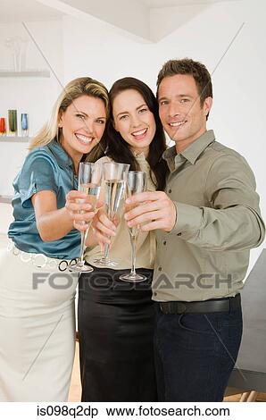 Friends celebrating with champagne View Large Photo Image Stock Photography - Friends celebrating with champagne. Fotosearch