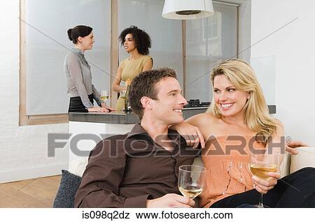 Friends talking at a dinner party View Large Photo Image Stock Photo - Friends talking at a dinner party. Fotosearch
