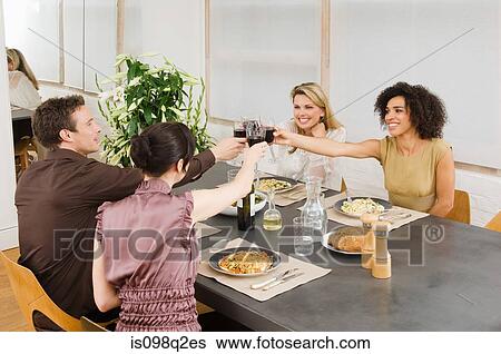Friends toasting with red wine View Large Photo Image Stock Photograph - Friends toasting with red wine. Fotosearch