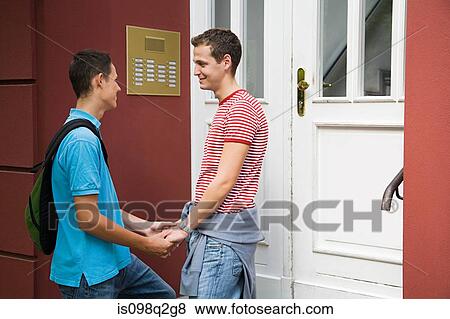 Stock Photo - A gay couple holding hands. Fotosearch
