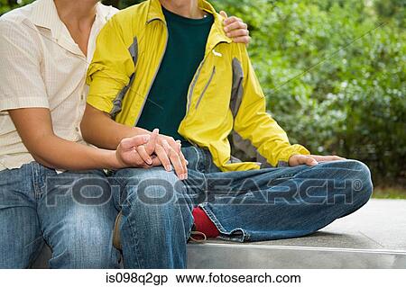 Stock Photography - A gay couple holding hands. Fotosearch