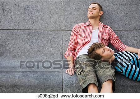 A gay couple relaxing View Large Photo Image Stock Image - A gay couple relaxing. Fotosearch