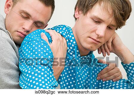 A man comforting his partner View Large Photo Image Stock Image - A man comforting his partner. Fotosearch