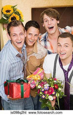 Portrait of friends with flowers and gifts View Large Photo Image Stock Photograph - Portrait of friends with flowers and gifts. Fotosearch