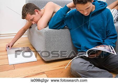 Stock Photo - Two men reading magazines. Fotosearch