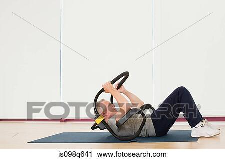A mature man doing sit ups View Large Photo Image Stock Image - A mature man doing sit ups. Fotosearch