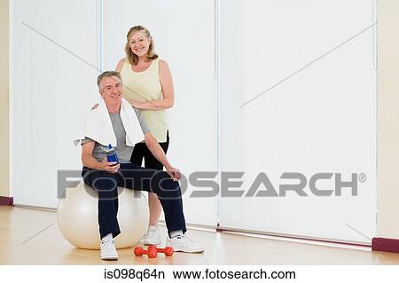 Portrait of a couple in a gym View Large Photo Image Picture - Portrait of a couple in a gym. Fotosearch