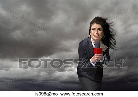 News presenter in storm View Large Photo Image Picture - News presenter in storm. Fotosearch