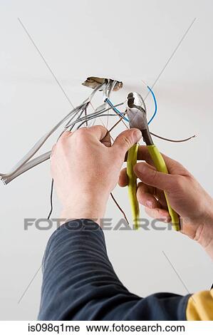 An electrician cutting wires View Large Photo Image Stock Image - An electrician cutting wires. Fotosearch
