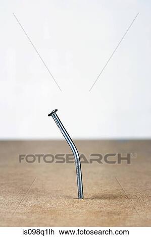 Stock Image - Bent nail. Fotosearch