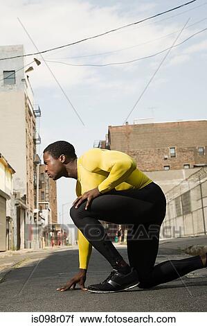 Stock Image - Athlete in urban setting. Fotosearch