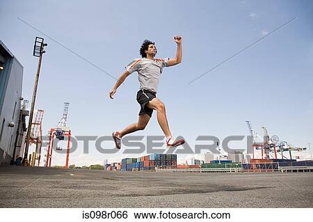 Man athlete jumping View Large Photo Image Stock Photograph - Man athlete jumping. Fotosearch