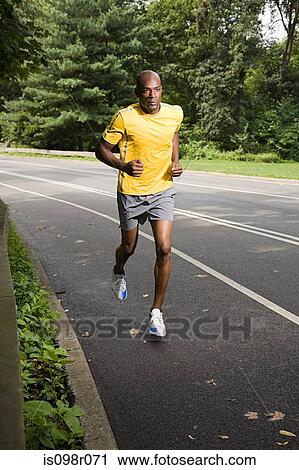Stock Image - Runner on road. Fotosearch