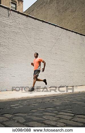 Stock Photo - Runner on street. Fotosearch