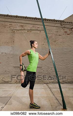 Runner stretching leg View Large Photo Image Stock Image - Runner stretching leg. Fotosearch