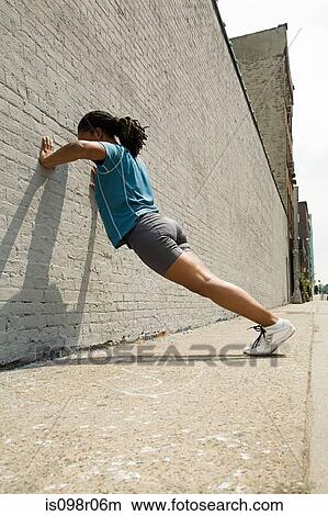 Picture - Runner stretching. Fotosearch