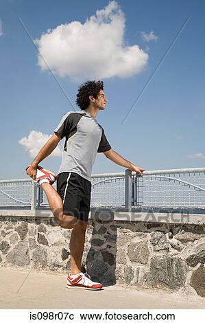 Runner stretching View Large Photo Image Stock Image - Runner stretching. Fotosearch