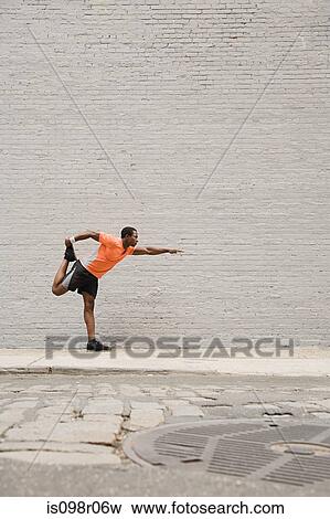 Runner stretching View Large Photo Image Stock Photo - Runner stretching. Fotosearch