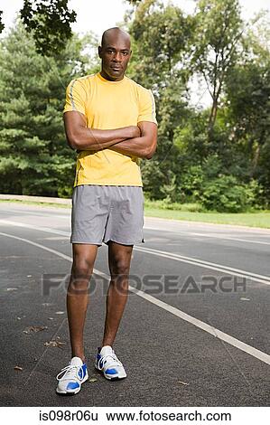 Stock Photograph - Runner with crossed arms. Fotosearch