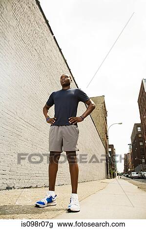 Runner with hands on hips View Large Photo Image Stock Image - Runner with hands on hips. Fotosearch