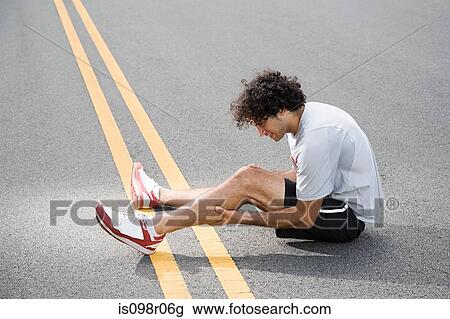 Runner with injured leg View Large Photo Image Stock Image - Runner with injured leg. Fotosearch