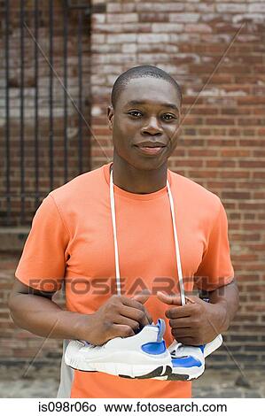 Picture - Runner with training shoes. Fotosearch