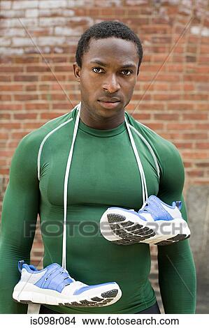 Runner with training shoes View Large Photo Image Picture - Runner with training shoes. Fotosearch