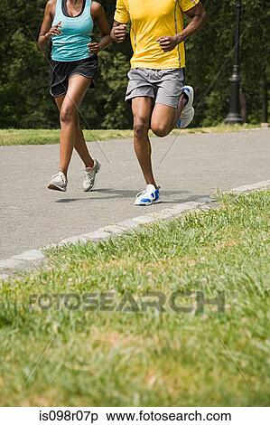Runners in park View Large Photo Image Stock Photography - Runners in park. Fotosearch