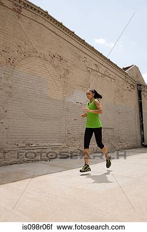 Woman running View Large Photo Image Stock Image - Woman running. Fotosearch