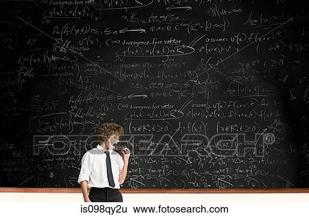 Boy with apple by blackboard View Large Photo Image Stock Photograph - Boy with apple by blackboard. Fotosearch