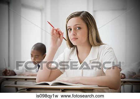 Stock Photo - Girl in classroom. Fotosearch