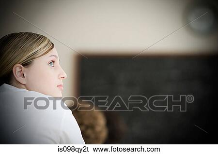 Girl in classroom View Large Photo Image Stock Photograph - Girl in classroom. Fotosearch