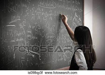 Girl writing on blackboard View Large Photo Image Stock Image - Girl writing on blackboard. Fotosearch