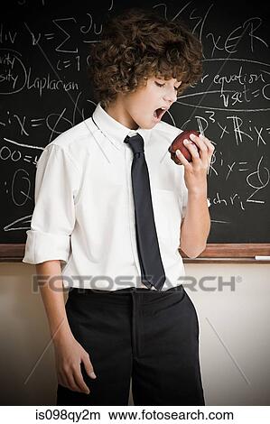 Picture - School boy with apple. Fotosearch