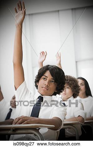 Stock Photo - School students with hands raised. Fotosearch