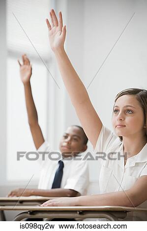 School students with hands raised View Large Photo Image Stock Photo - School students with hands raised. Fotosearch